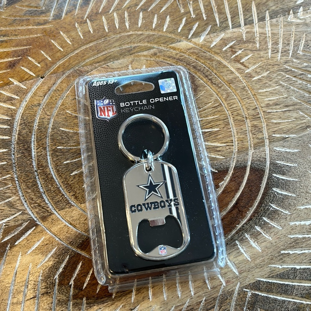 New in package NFL registered Dallas Cowboys keychain bottle opener
